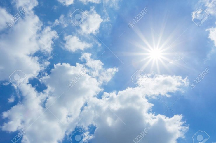 31996606-the-sun-shines-bright-in-the-daytime-in-summer-blue-sky-and-clouds-.jpg