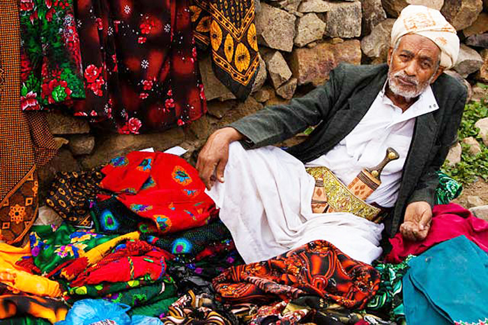 Photo-10-A-man-selling-woman-clothes-at-a-market.jpg
